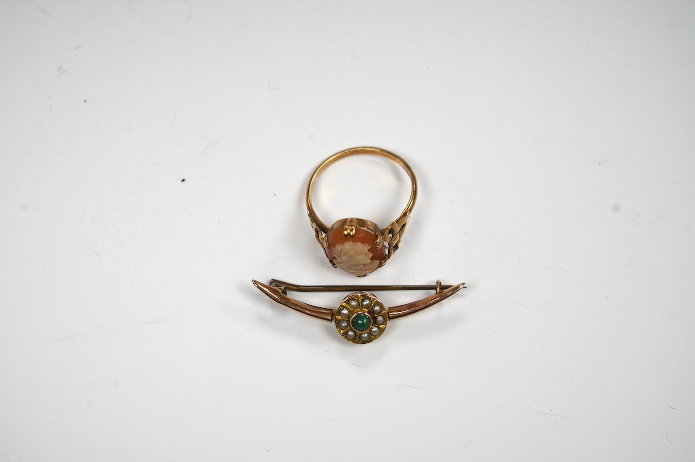 An early 20th century 9ct, seed pearl and turquoise cluster set crescent brooch, 39mm, together with a 9ct and oval cameo shell set ring, gross weight 5.1 grams. Condition - fair to good